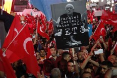 Erdogan vows to go after businesses linked to coup bid