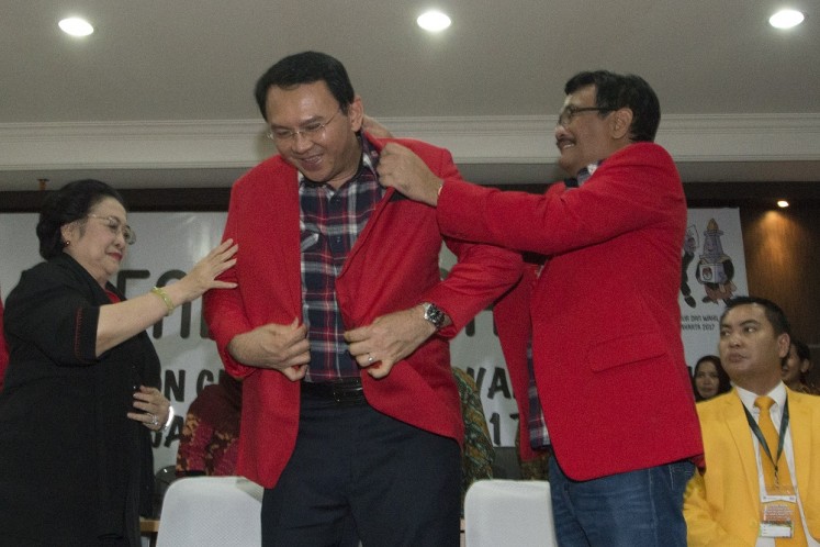 Megawati dresses Ahok with red jacket