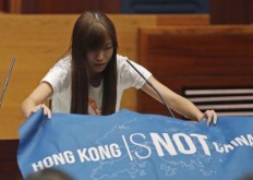 Pro-democracy Hong Kong lawmakers defy China in oath taking 