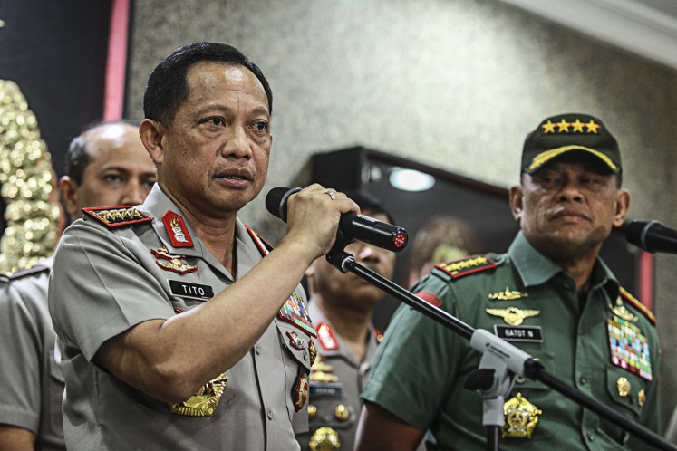 On alert: National Police chief Gen. Tito Karnavian (left) and Indonesian Military commander Gen. Gatot Nurmantyo give a statements to the press after a meeting at National Police headquarters in Jakarta on Nov.21. 