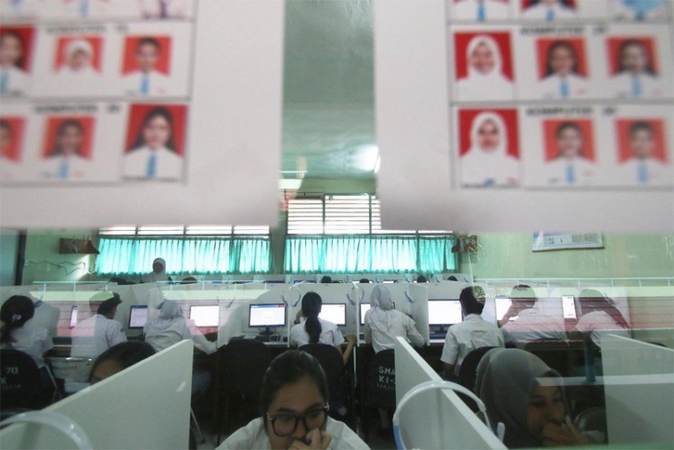 Several students take the computer-based National Examination at SMAN 70 High School in Jakarta on Monday. There are 63,883 high-school-level students in Jakarta writing the computer-based national exam on Monday out of 133,961 high school and equivalent-level students.