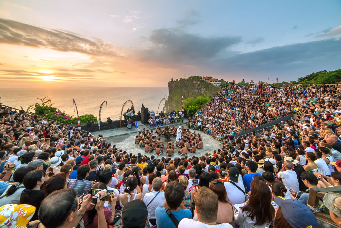 Tourists watch a traditional Balinese Kecak Dance at Uluwatu Temple in Bali. Image: shutterstock.com/Alexander Mazurkevich/The Jakarta Post File