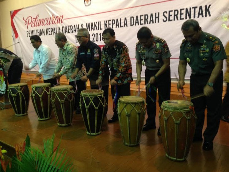 General Elections Commission (KPU) chairman Arief Budiman (third left), along with officials from government institutions and security forces, beat drums marking the start of preparations for the 2018 regional elections at KPU headquarters in Jakarta, in June.