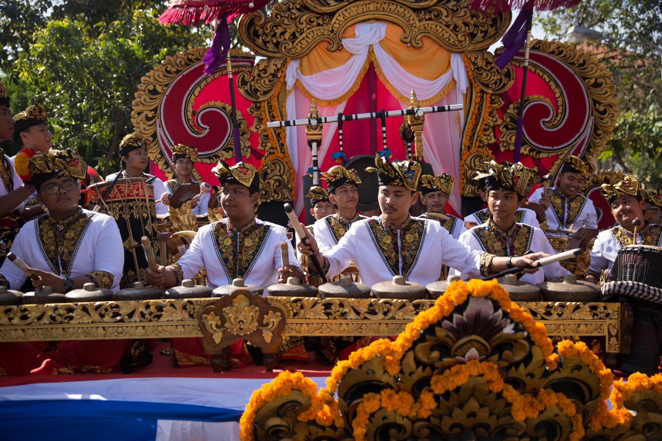 Young Balinese men play in a gambean (Balinese orchestra) during the opening of the 39th Bali Art Festival at the Bajra Sandhi Monument in Denpasar. Image: JP/Agung Parameswara