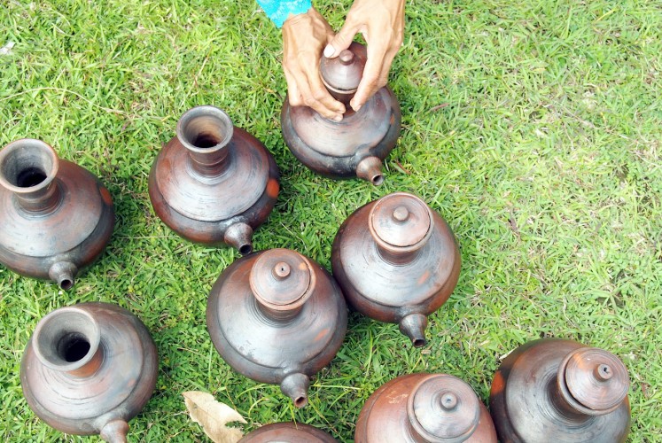 Storage: Jugs containing rainwater are prepared for a parade.