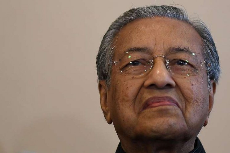 Malaysia's former prime minister Mahathir Mohamad addresses journalists in Putrajaya on July 18, 2017
