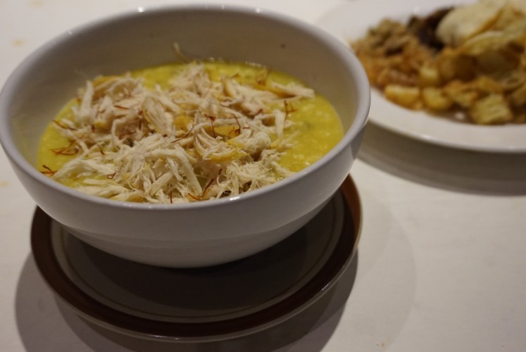 Visitors are recommended to try Aneka Bubur 786's Bubur Zafran (porridge made with saffron, shredded chicken and chickpeas) which is full of spices and is accompanied by condiments, such as cakwe (fried wheat) and emping (nut crackers). 