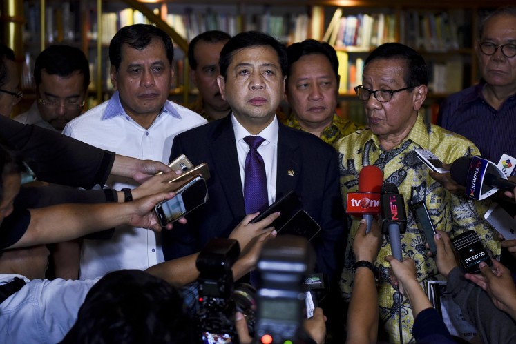 Suspect: Golkar Party chairman Setya Novanto (center) gives a statement to the press after meeting with Golkar's ethics council chairman BJ Habibie in Jakarta on July 24.