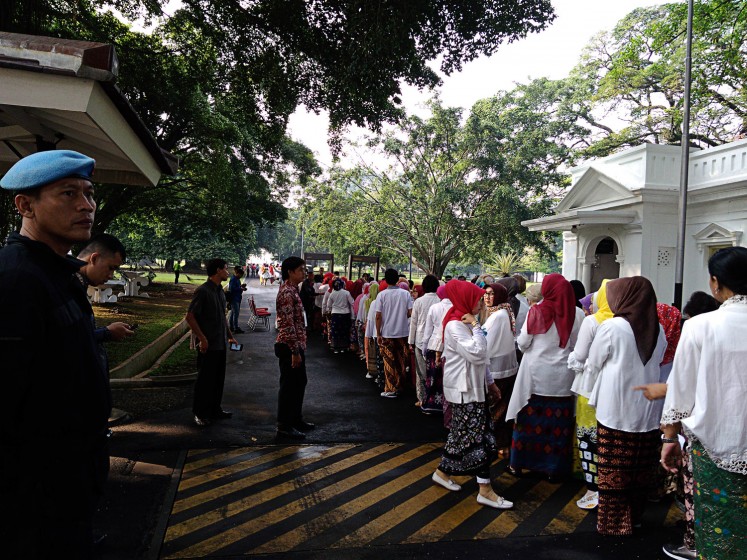 Preserving cultural heritage: Palace for the People participants queue to enter Bogor Palace on Monday.