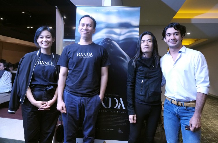 Producer Sheila Thimoty (left) poses alongside head of consumer engagement and corporate marketing at PT. Indofood Sukses Makmur Firman Authar (second left), director Jay Subyakto (second right) and actor Reza Rahardian at the press screening of 'Banda: The Dark Forgotten Trail' at Cinema XXI, Plaza Indonesia, Jakarta, Wednesday, July 26, 2017.