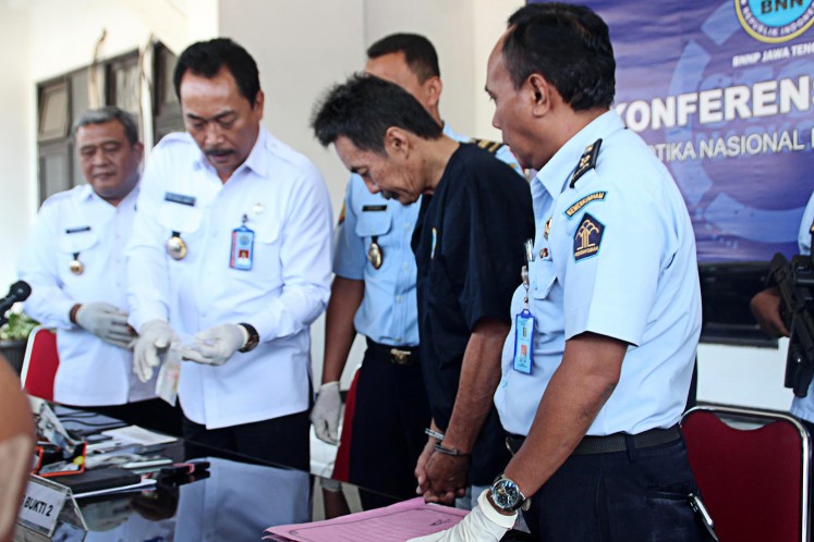 Evidence: Central Java BNNP officers show evidence confiscated from drug convict Bambang Budianto (second right) during the Aug. 1 press conference.