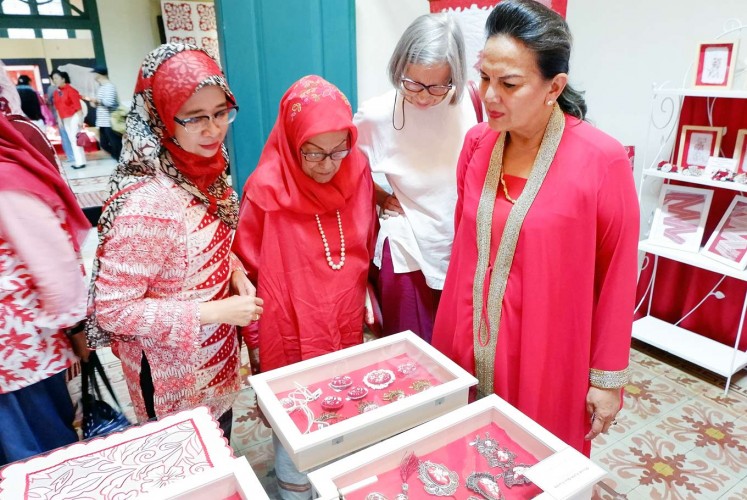 Fascinated: Actress Christine Hakim (left) and her friends attend the Merah Putih exhibition.
