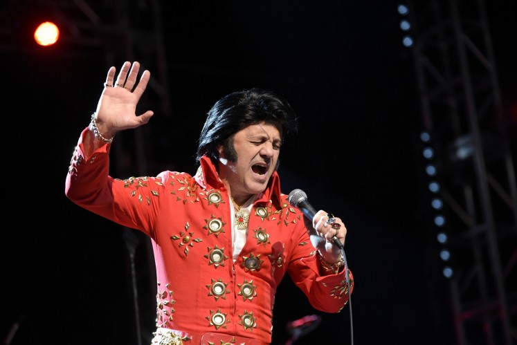 Elvis tribute artist Ede Danna of Brazil performs during the preliminary round of the 'Images of the King' contest.