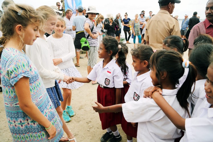 New friends: A number of primary school students of the Ohoi village in Debut welcome children who join their parents in cruising the Indonesian waters during the Wonderful Sail 2 Indonesia Rally 2017.