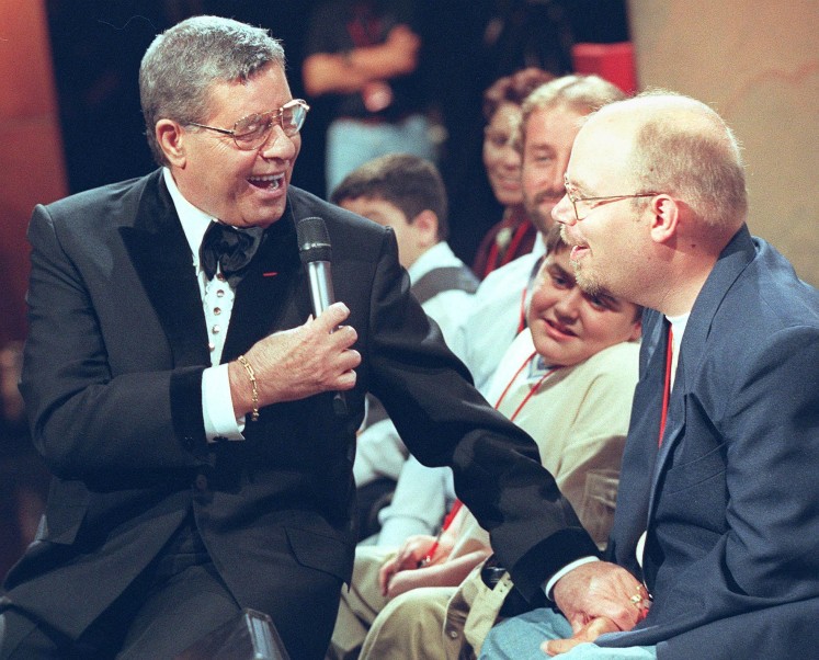 This file photo taken on September 5, 1999 shows
US comedian Jerry Lewis introducing himself to the studio audience at the start of the 34th annual Jerry Lewis Telethon to benefit the Muscular Dystrophy Association in Hollywood Lewis, whose goofy brand of physical comedy endeared him to millions in a career spanning six decades, died on August 20, 2017, aged 91, his agent told AFP. Lewis perfected the role of the quirky clown in slapstick comedies like 