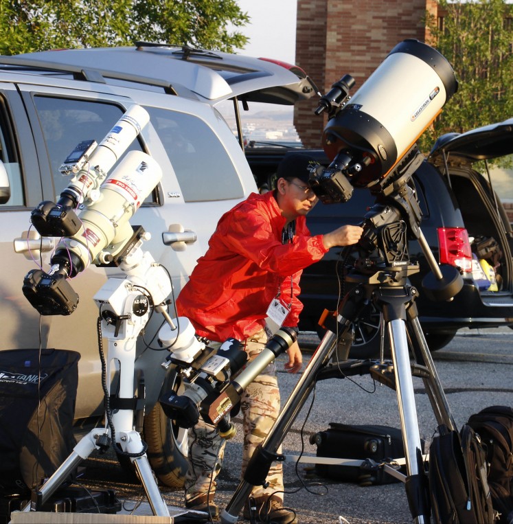 Astrocon attendees setup telescopes for the Great American Eclipse on August 21, 2017, in Casper, Wyoming. Emotional sky-gazers stood transfixed across North America Monday as the Sun vanished behind the Moon in a rare total eclipse that swept the continent coast-to-coast for the first time in nearly a century.