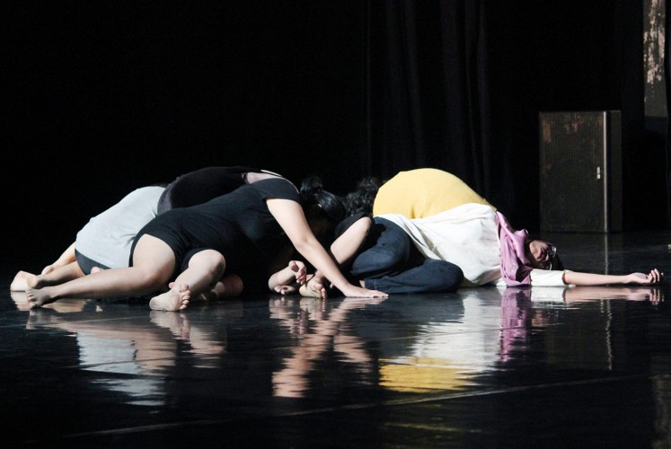 Body language: Dancers of CANdoDANCE lie on the stage during a preview of their contemporary dance.