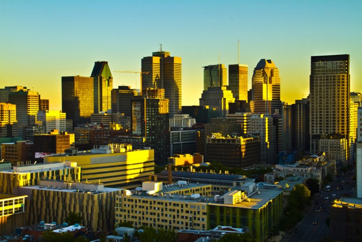 Montreal skyline bathed in sunset rays.