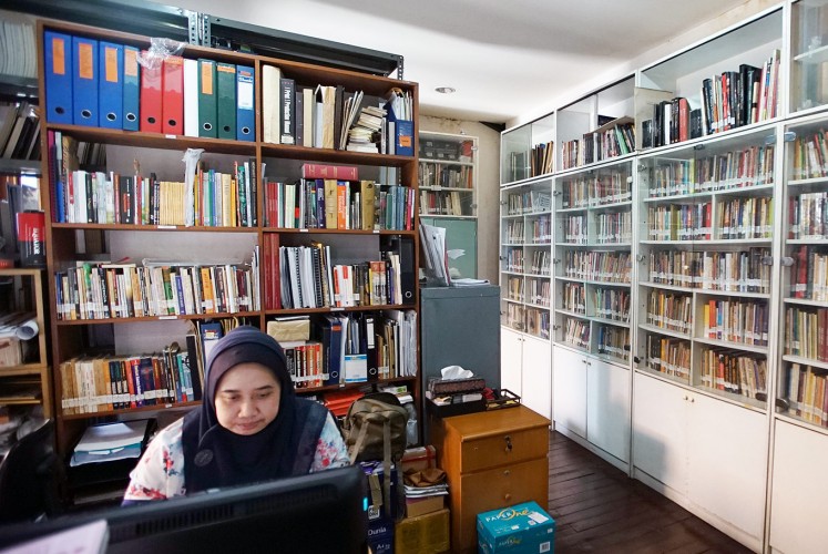 Getting immersed: A woman works in the library of the Lontar Foundation in Pejompongan, Central Jakarta.