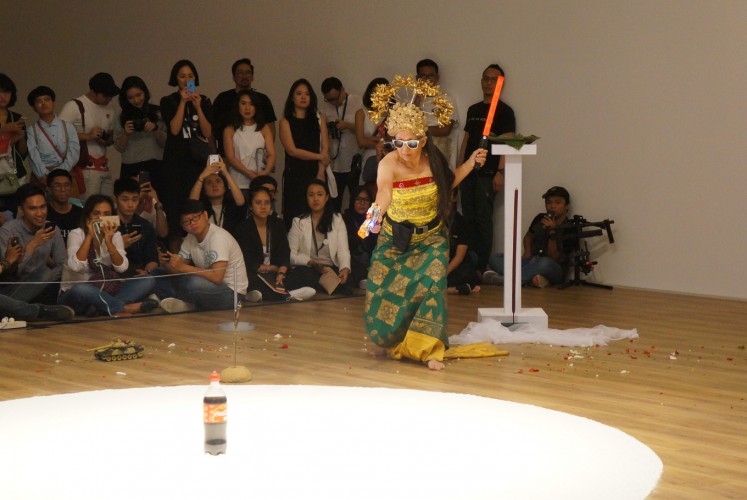 Indonesian artist Arahmaiani performs 'Handle without Care.'