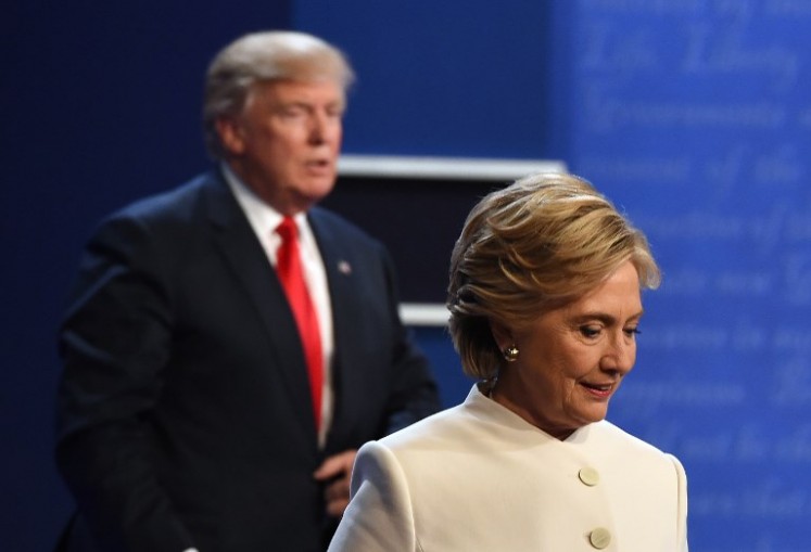 This file photo taken on Oct. 19, 2016 shows
former Democratic nominee Hillary Clinton (R) and former Republican nominee Donald Trump walking off the stage after the final presidential debate at the Thomas & Mack Center on the campus of the University of Las Vegas in Las Vegas, Nevada. Hillary Clinton calls Donald Trump a 