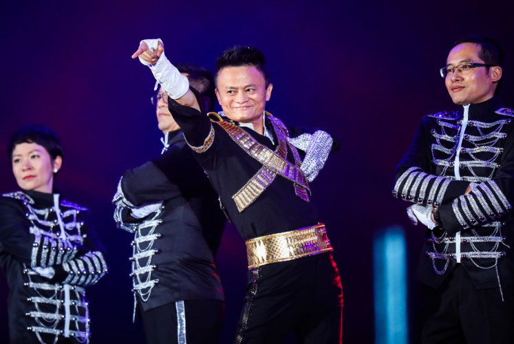 This photo taken on September 8, 2017 shows Jack Ma, chairman of Alibaba group, dancing to a medley of Michael Jackson songs during the Alibaba Annual Party at the Huanglong sports center in Hangzhou in China's eastern Zhejiang province. Ma danced with other Alibaba employees during the party, which was held to celebrate the 18th anniversary of the company's founding.