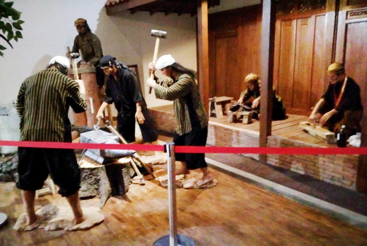 Making kris: A diorama depicts the production of traditional kris blades at the Museum Keris Nusantara.