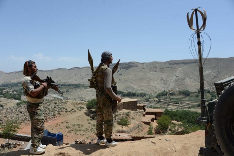 In this photograph taken on June 20, 2017, Afghan security personnel keep watch during the ongoing offensive to retake Tora Bora in Pachir Aw Agam district, in Nangarhar province, that is held by the Islamic State (IS) group. IS fighters have captured Tora Bora, a mountain cave complex in eastern Afghanistan that was once the hideout of Osama bin Laden, despite pressure on the jihadists from US-led forces.