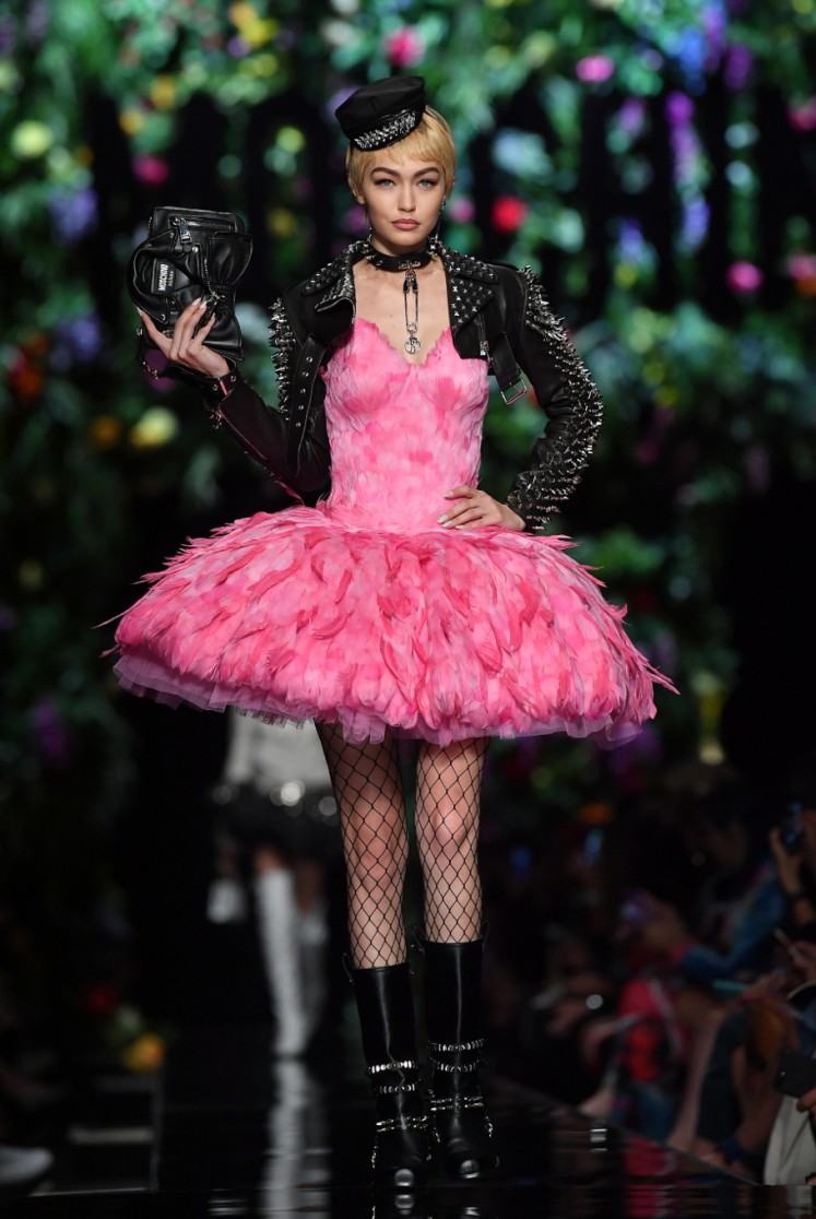 Model Gigi Hadid presents a creation for fashion house Moschino during the Women's Spring/Summer 2018 fashion shows in Milan, on September 21, 2017. 