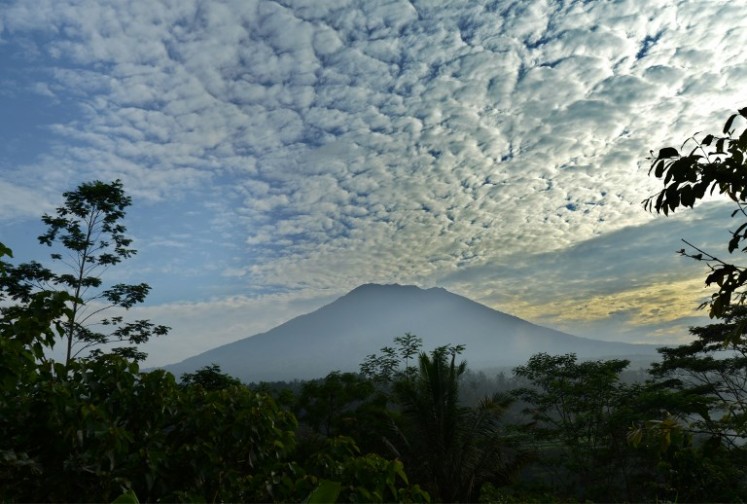 A general view shows Mount Agung from Karangasem on the  resort island of Bali on Sept. 24, 2017. Authorities have raised alert levels for a volcano on the Indonesian resort island of Bali after hundreds of small tremors stoked fears it could erupt for the first time in more than 50 years.