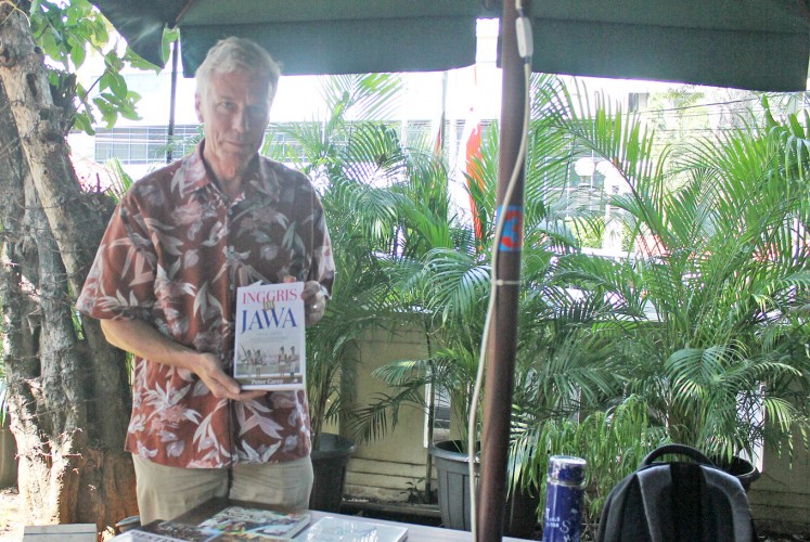 Translated: Peter Carey poses with the Indonesian-language edition of his book, The British in Java, 1811-1816.