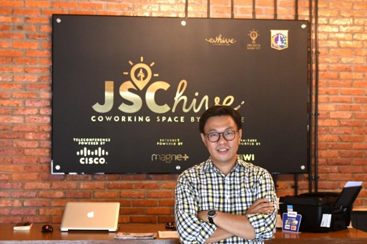 This picture taken on Sept. 12, 2017 shows Willson Cuaca, one of the co-owners of the EV-Hive event space, a co-working space, in Jakarta. Big-name investors including Expedia and Alibaba are pumping billions of dollars into Indonesian tech start-ups in a bid to capitalise on the country’s burgeoning digital economy and potential as Southeast Asia’s largest online market. Indonesia has seen a surge of cash into its technology sector over the past two years, helping support dozens of homegrown start-ups ranging from ride hailing apps to e-commerce firms.