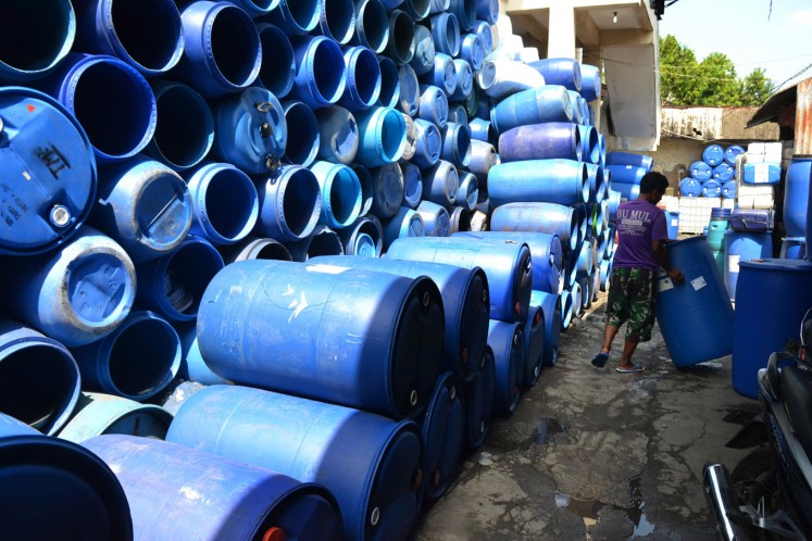 Used plastic barrels, collected from factories across Surakarta, await their turn to be transformed into a new, useful product.