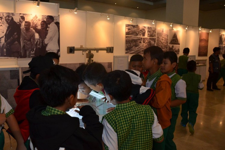 Students marvel at one of the documents displayed in the exhibition.
