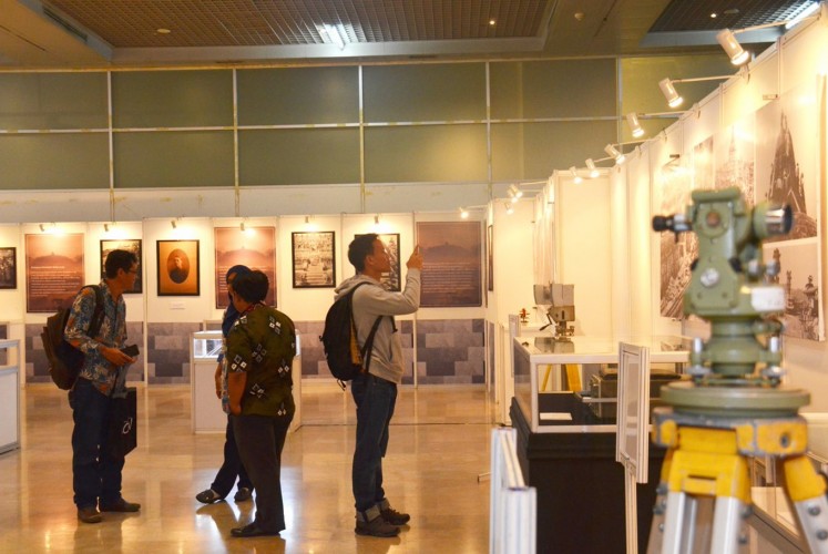 One visitor takes a photo of one of the exhibition's collections.