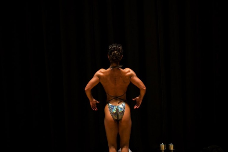 In this picture taken on October 9, 2017, Japanese bodybuilder Noriko Isoyama warms up backstage during the Japan bodybuilding championships in Tokyo. The number of bodybuilders registered with Japan's national federation has almost doubled over the past six years to around 3,000, with women making up 10 percent as part of a nationwide fitness boom, officials said. In ageing Japan, female bodybuilding is dominated by women in their forties and fifties, as many usually only start after their children have grown up.