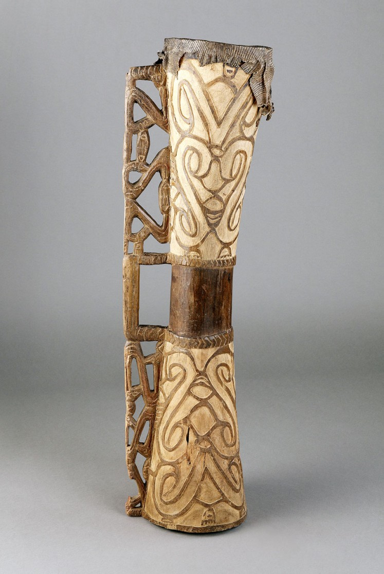 Exotic: Tambur percussion instrument made of wood and reptile skin.