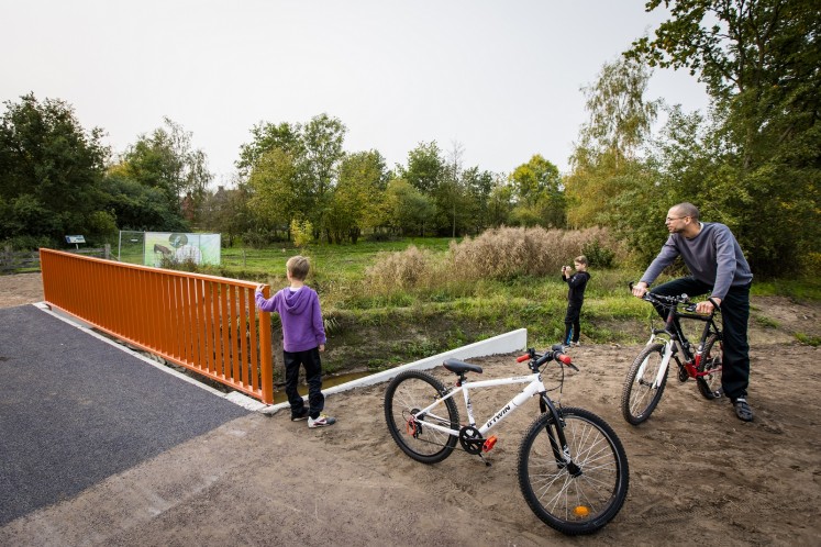 Dutch officials toasted the opening of what is being dubbed as the world's first 3D-printed concrete bridge, which is primarily meant to be used by cyclists.