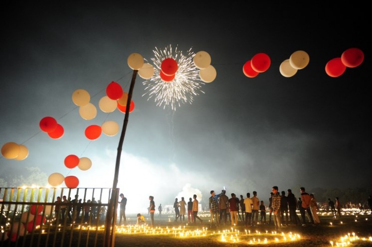 Indian athletes watch fireworks at the Madan Mohan Malviya stadium on the eve of the Hindu festival of Diwali in Allahabad on Oct. 18, 2017. Diwali, the Festival of Lights, marks victory over evil and commemorates the time when Hindu god Lord Rama achieved victory over Ravana and returned to his kingdom Ayodhya.
