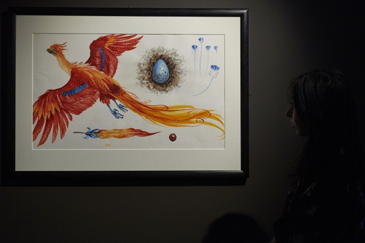 An illustration of Fawkes, Professor Dumbledore's loyal Phoenix, is on display during the 'Harry Potter' exhibit preview on Oct. 18.