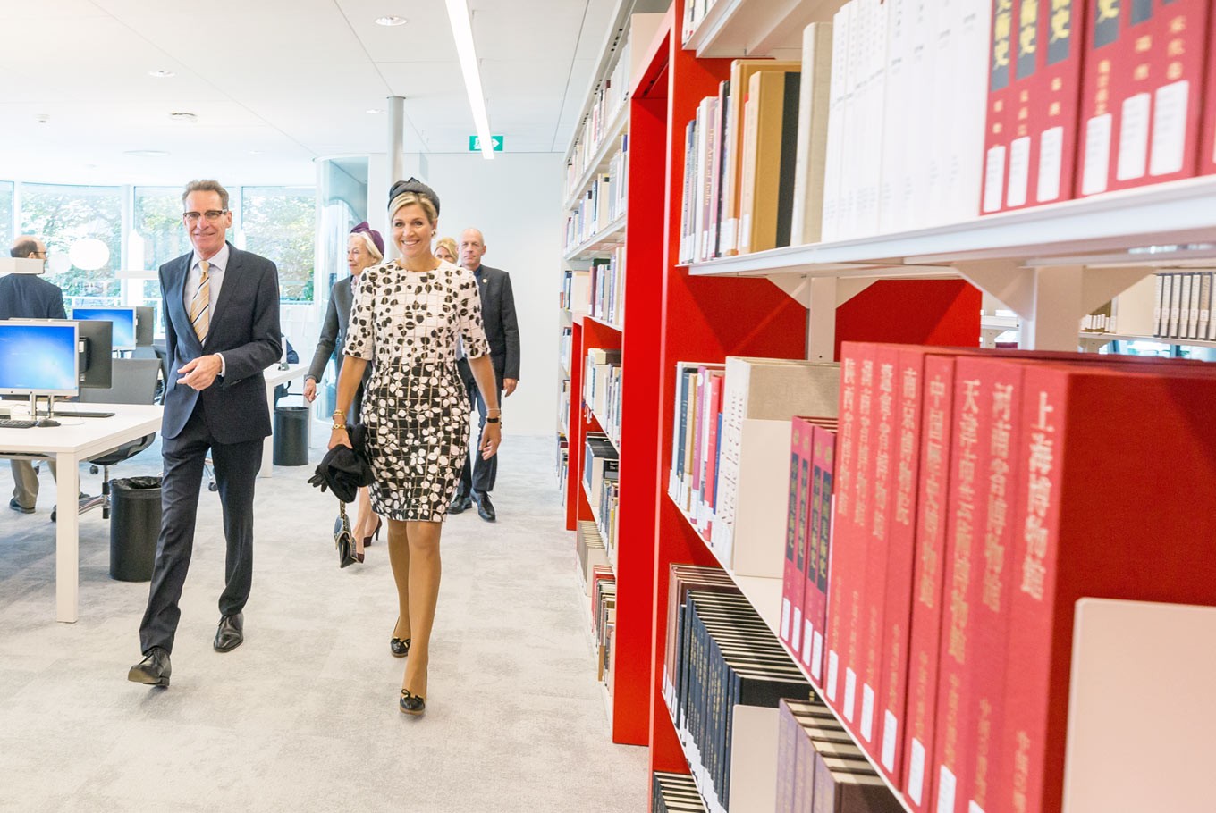 Royal inspection: Queen Máxima of the Netherlands (right) walks through the Asian Library, accompanied by KITLV head Geert Oostindie. (Leiden University/Monique Shaw)