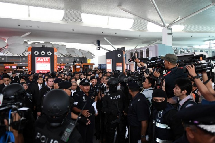 High Court judge Azmi Ariffin (unseen) lawyers for Vietnamese and Indonesian defendant arrive at the low-cost carrier Kuala Lumpur International Airport 2 (KLIA2) during a visit to the scene of the murder as part of the Shah Alam High Court trial process in Sepang on Oct. 24, 2017. Indonesian Siti Aisyah, 25, and Huong, 28, have been charged with the murder of Kim Jong-Nam, the estranged half-brother of North Korean leader Kim Jong-Un, at Kuala Lumpur International Airport 2 (KLIA2) in February.