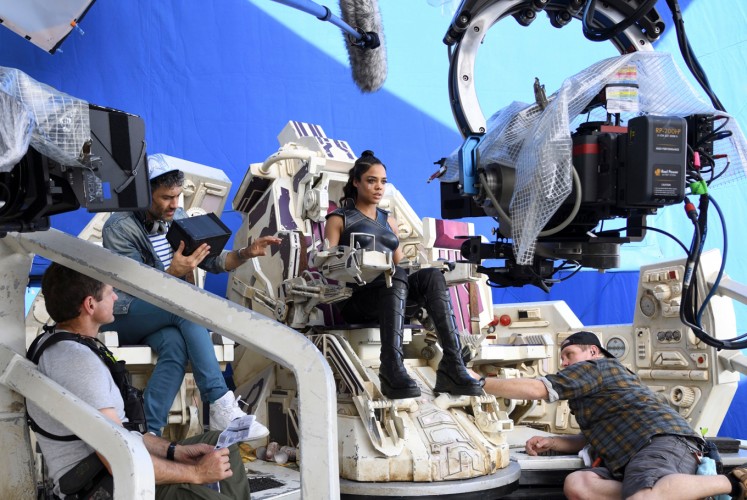 On set with director Taika Waititi (upper left) and Tessa Thompson, who plays Valkyrie (center).