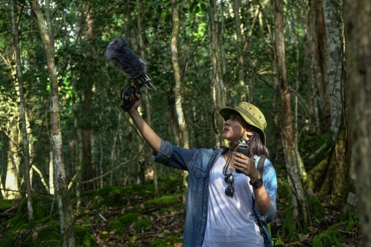 Ninda Felina records rainforest sounds that surround Malagufuk village. 