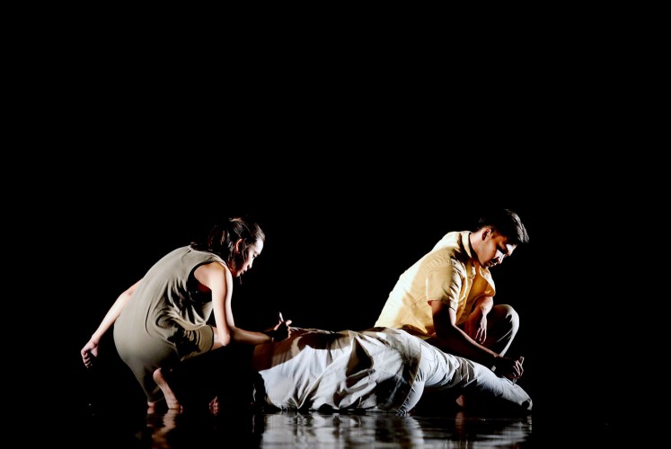 In the dark: Indonesian Dance Theater performs a theatrical dance titled 'A Walk at Pedestrian.' Created by choreographer Josh Marcy Putra Pattiwael, the dance takes inspiration from a poem by WS Rendra titled 'Sajak Orang Miskin' (Poetry of the Poor).