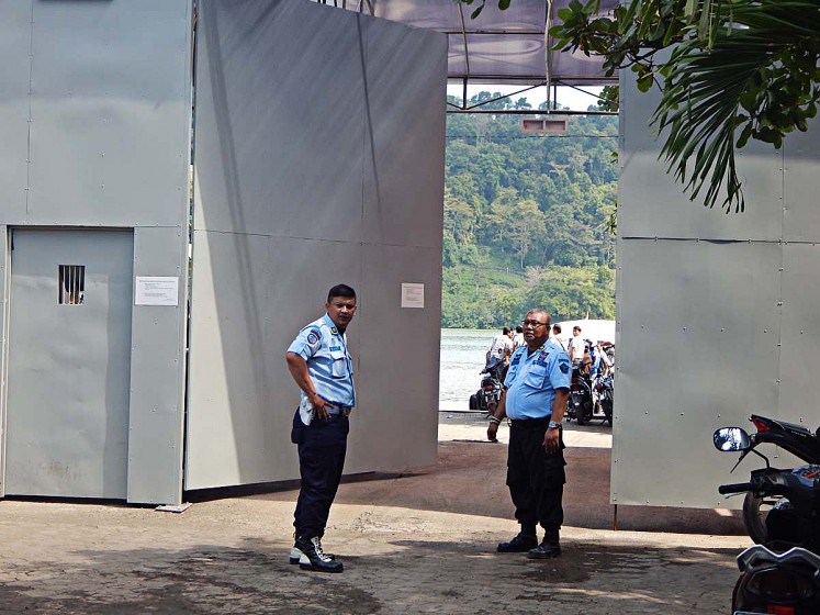 On alert: Security guards step up their measures  after a deadly clash between inmates convicted of terrorism and supporters of John Kei erupted on the Nusakambangan prison island on Nov. 7.