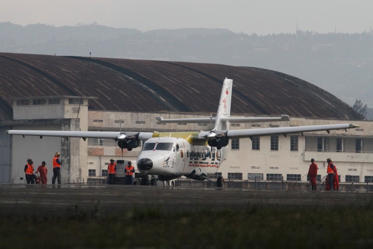 Airworthy: The N-219 aircraft lands on the runway at Husein Sastranegara Air Force Base in Bandung, West Java, after it undergoes a flying test on Aug.16.