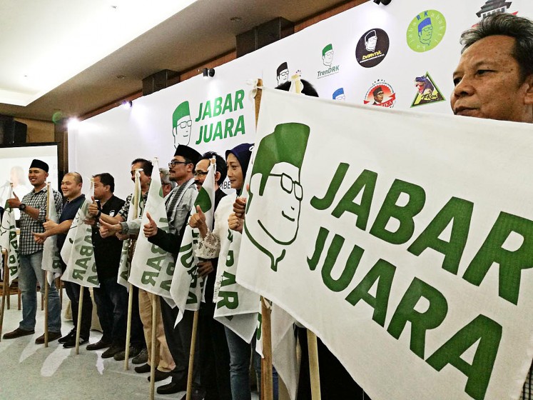Show of support: Supporters of Ridwan Kamil join Relawan Jawa Barat Juara on Sunday to launch a crowdfunding scheme to support the Bandung mayor's gubernatorial campaign for the 2018 election. 
