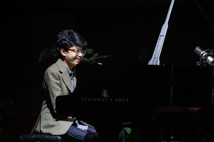 Mesmerizing: Young Indonesian pianist and 2016 Grammy Awards nominee Joey Alexander performs at the Tourism Ministry in Jakarta on Sunday. Jakarta is the final destination of his concert tour 'A Night of a Million Imaginations,' after Japan, Singapore and Hong Kong.
