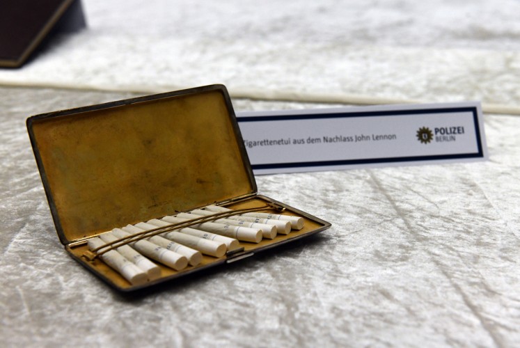 A cigarette case from the estate of John Lennon is pictured during a press conference on November 21, 2017 in Berlin. German police on November 20, 2017 had arrested a 58-year-old man in Berlin on suspicion of handling the stolen items, including the late Beatle's diaries. The items were stolen from Lennon's widow Yoko Ono in New York in 2006.